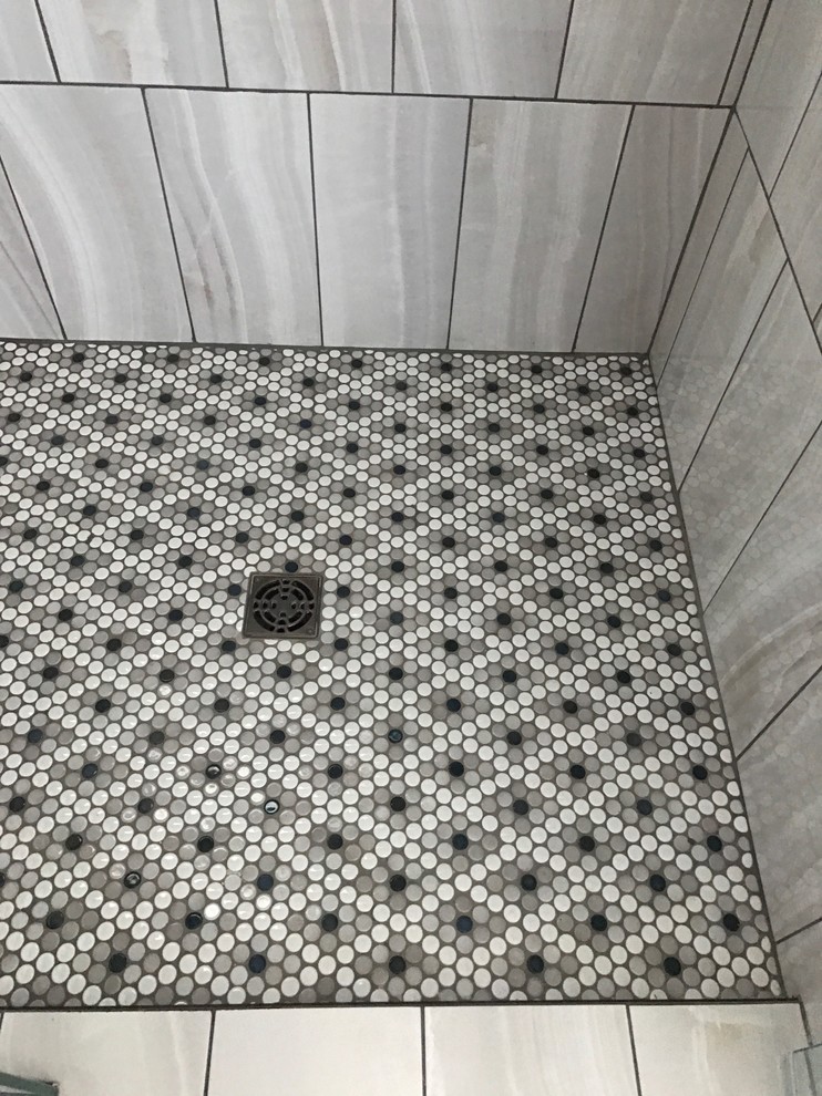 Inspiration for a mid-sized transitional master gray tile and porcelain tile mosaic tile floor and gray floor alcove shower remodel in Phoenix with a pedestal sink, black walls and a hinged shower door