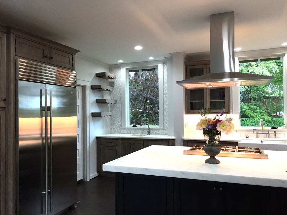 Kitchen - transitional ceramic tile and black floor kitchen idea with an undermount sink, shaker cabinets, medium tone wood cabinets, marble countertops, white backsplash, ceramic backsplash and an island