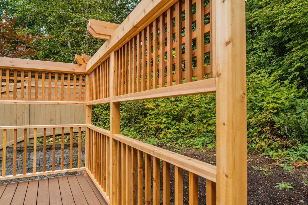 Example of a mid-sized backyard deck design in Seattle
