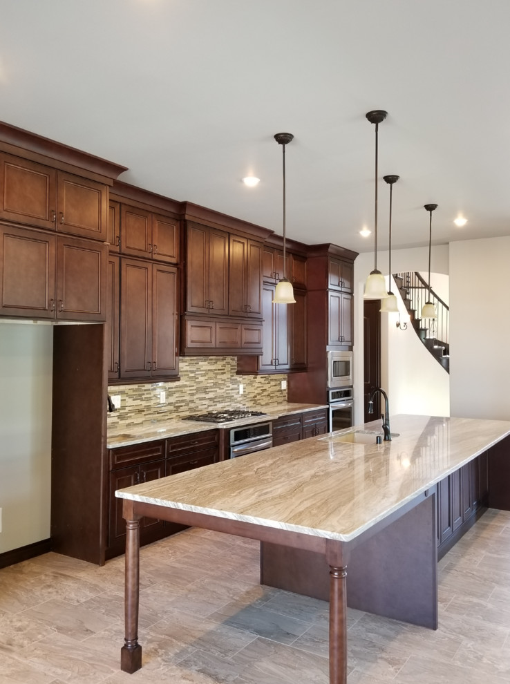 Inspiration for an expansive contemporary galley eat-in kitchen in Cleveland with an undermount sink, flat-panel cabinets, brown cabinets, marble benchtops, brown splashback, mosaic tile splashback, stainless steel appliances, terrazzo floors, with island, brown floor and brown benchtop.