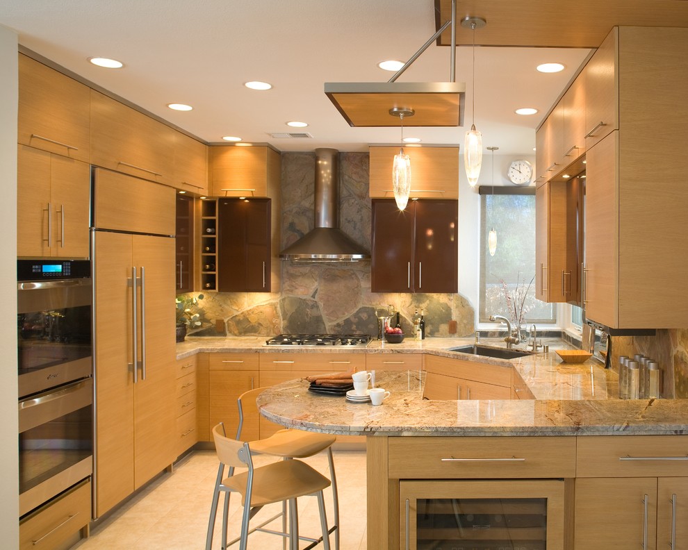 Inspiration for a contemporary u-shaped kitchen in San Diego with a single-bowl sink, flat-panel cabinets, light wood cabinets, marble benchtops and panelled appliances.