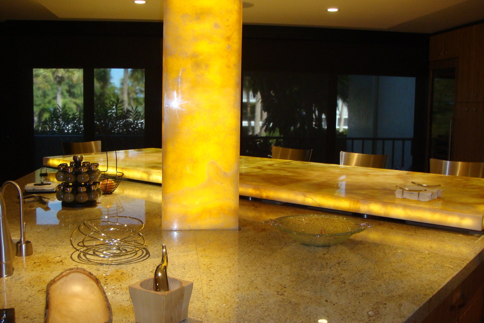 Kitchen in Tampa with granite benchtops, with island and yellow benchtop.