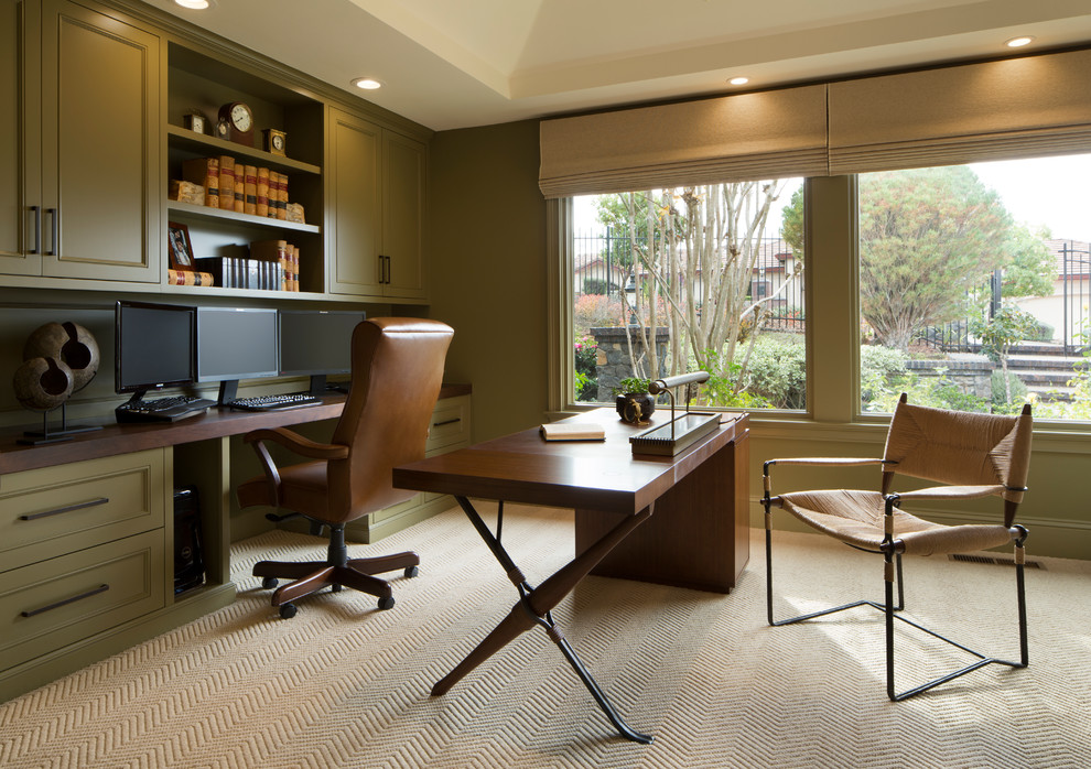 This is an example of a mid-sized contemporary study room in San Francisco with grey walls, carpet, no fireplace, a built-in desk and beige floor.
