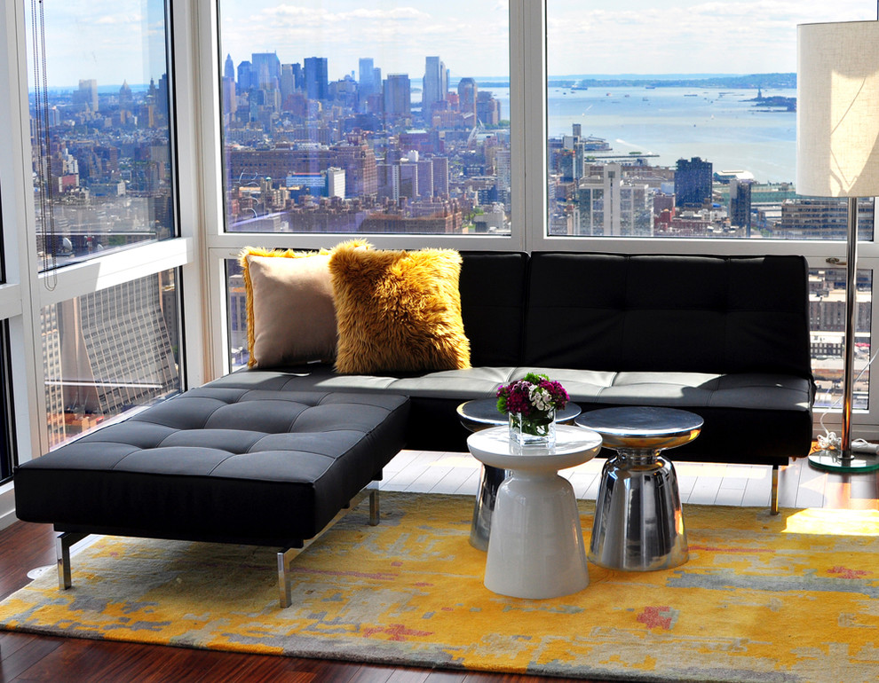 Photo of a contemporary open concept living room in New York.