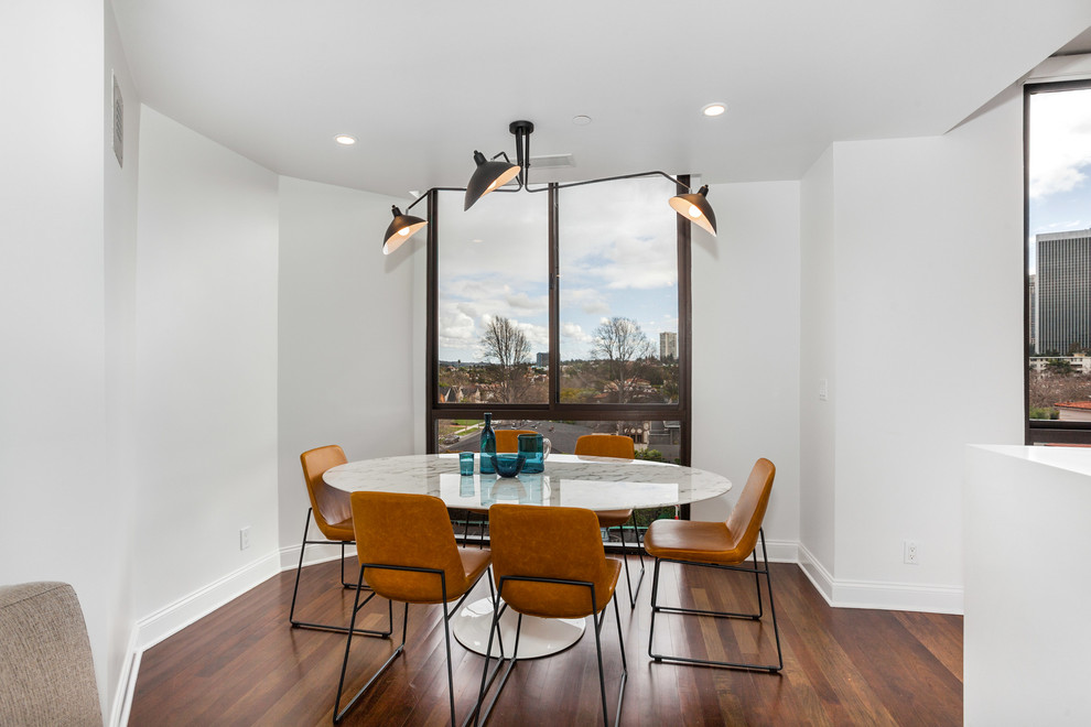 Kitchen/dining room combo - small modern dark wood floor and brown floor kitchen/dining room combo idea in Los Angeles with gray walls and no fireplace