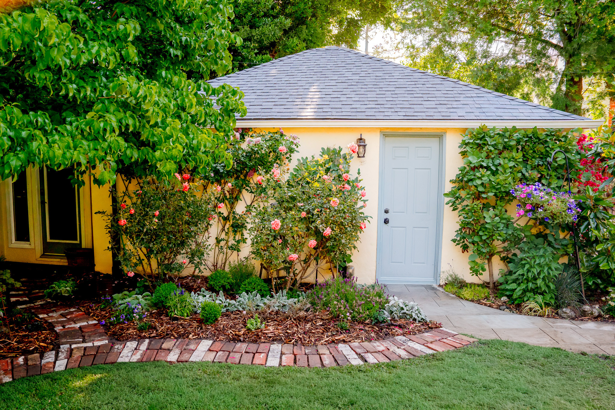 Reclaimed Brick Pathway with Roses and Seasonal Color