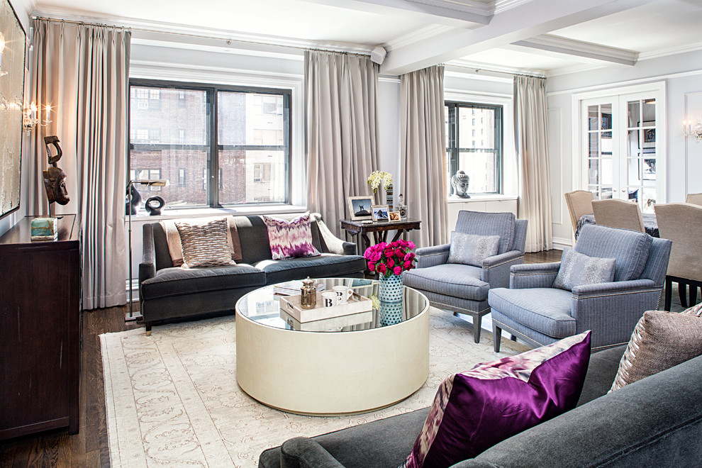 This is an example of a transitional living room in New York with grey walls.