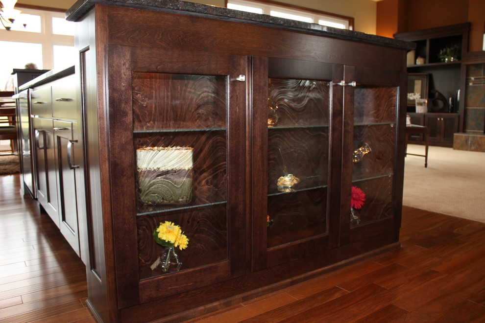 Inspiration for a mid-sized transitional l-shaped medium tone wood floor open concept kitchen remodel with medium tone wood cabinets, granite countertops, multicolored backsplash, mosaic tile backsplash, stainless steel appliances, an island and recessed-panel cabinets