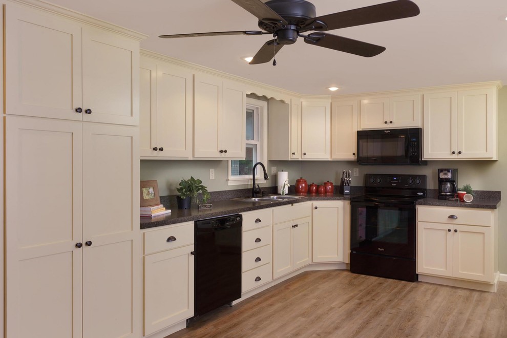 Enclosed kitchen - mid-sized transitional u-shaped light wood floor and beige floor enclosed kitchen idea with white cabinets, granite countertops, a double-bowl sink, shaker cabinets, black appliances, no island and gray countertops