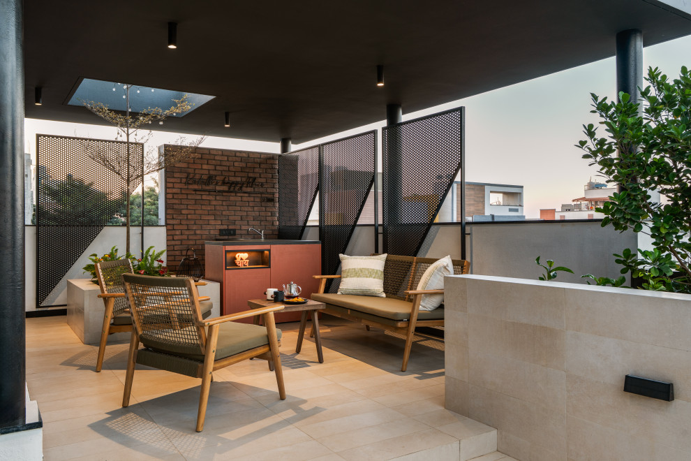 This is an example of an industrial terrace & balcony in Bengaluru With a Roof Extension.