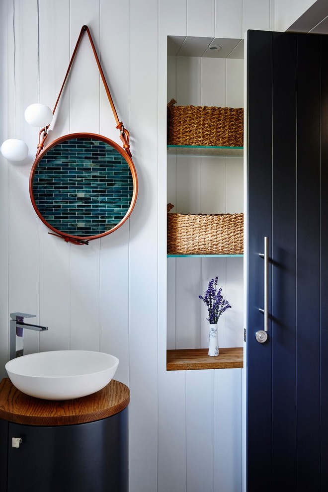 Inspiration for a beach style powder room in Central Coast with white walls and a vessel sink.