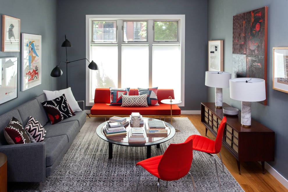 Living room - contemporary formal and enclosed medium tone wood floor living room idea in New York with gray walls