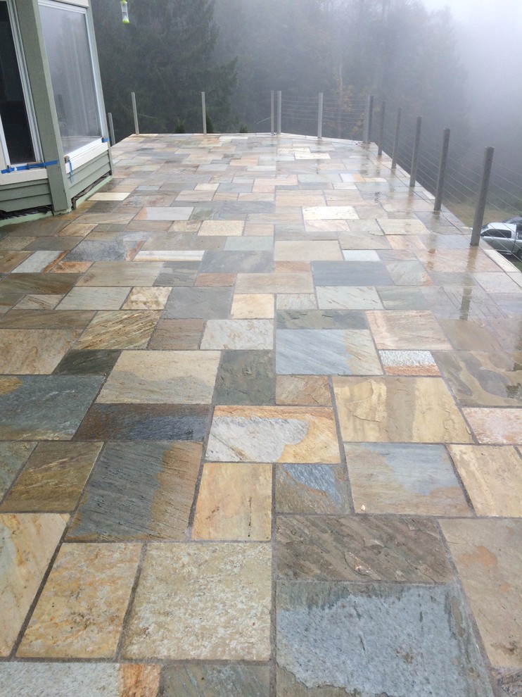 Deck - large modern backyard deck idea in Seattle with no cover