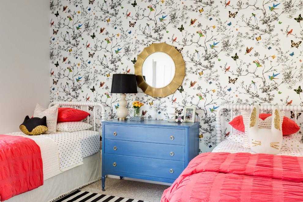 This is an example of a contemporary kids' room for girls in Phoenix with multi-coloured walls and carpet.