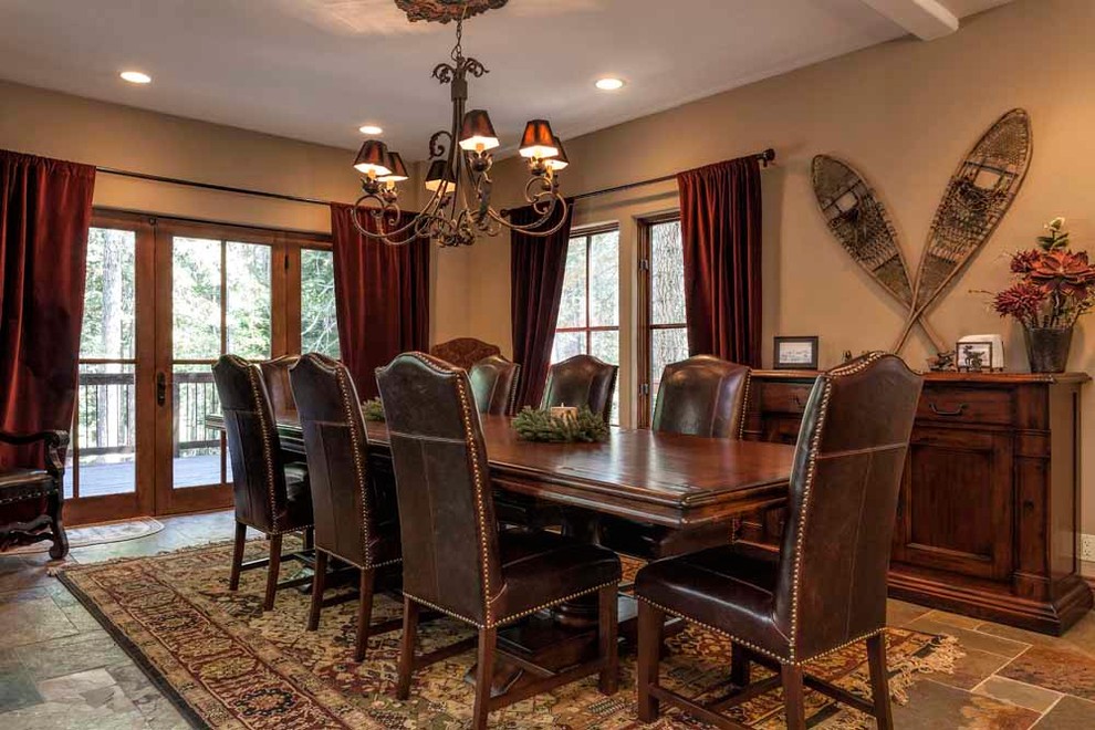 This is an example of an expansive arts and crafts separate dining room in Sacramento with beige walls, slate floors and no fireplace.