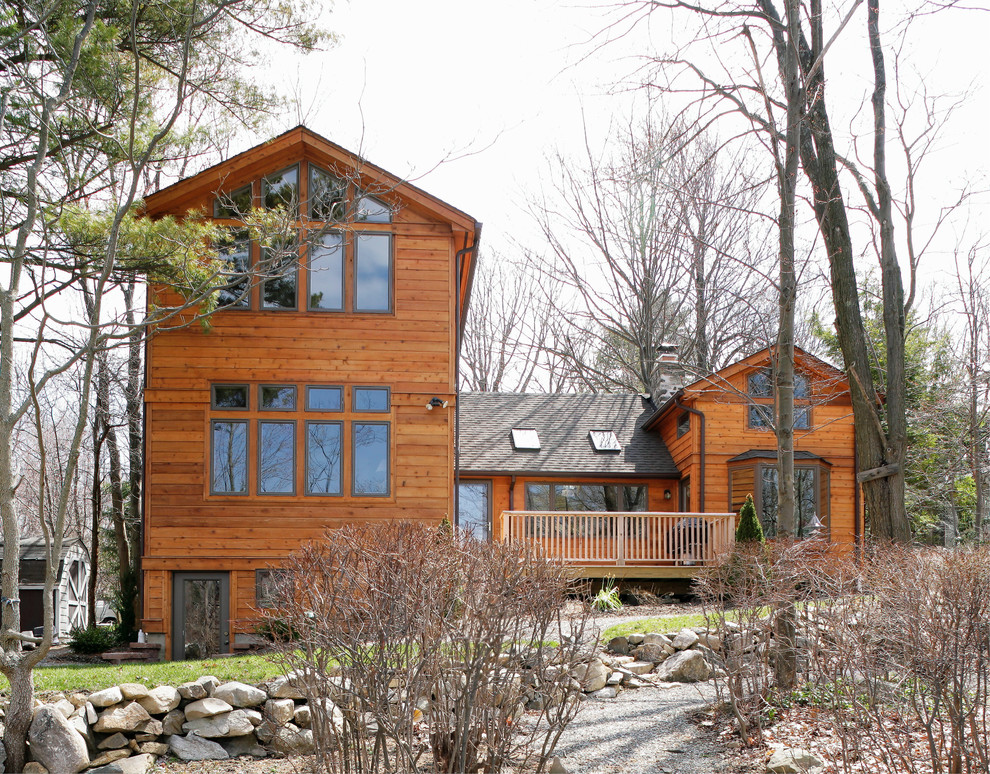 Mid-sized country two-storey exterior in New York with wood siding.