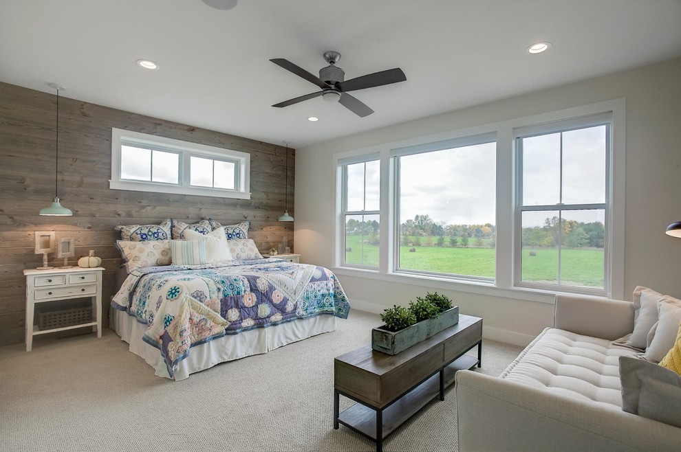 Mid-sized country master bedroom in Grand Rapids with beige walls, carpet and beige floor.