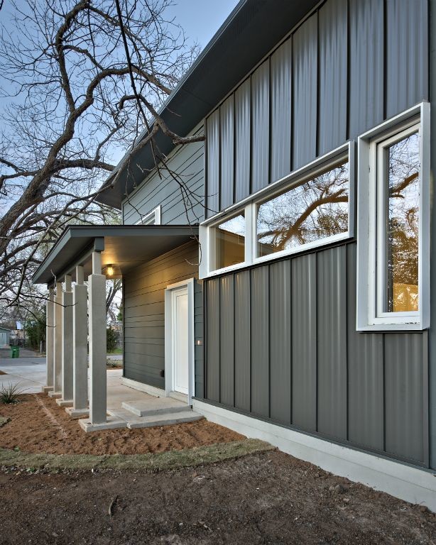 Design ideas for a small contemporary one-storey exterior in Austin with metal siding and a shed roof.