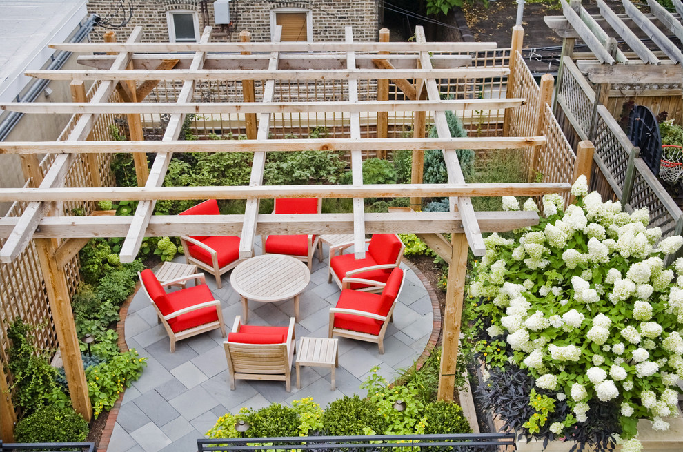 Inspiration for a contemporary backyard patio in Chicago with a pergola.