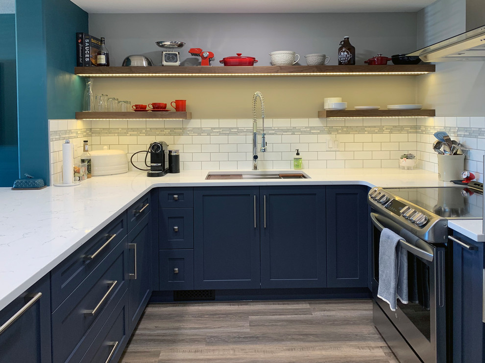 Example of a transitional kitchen design in Calgary