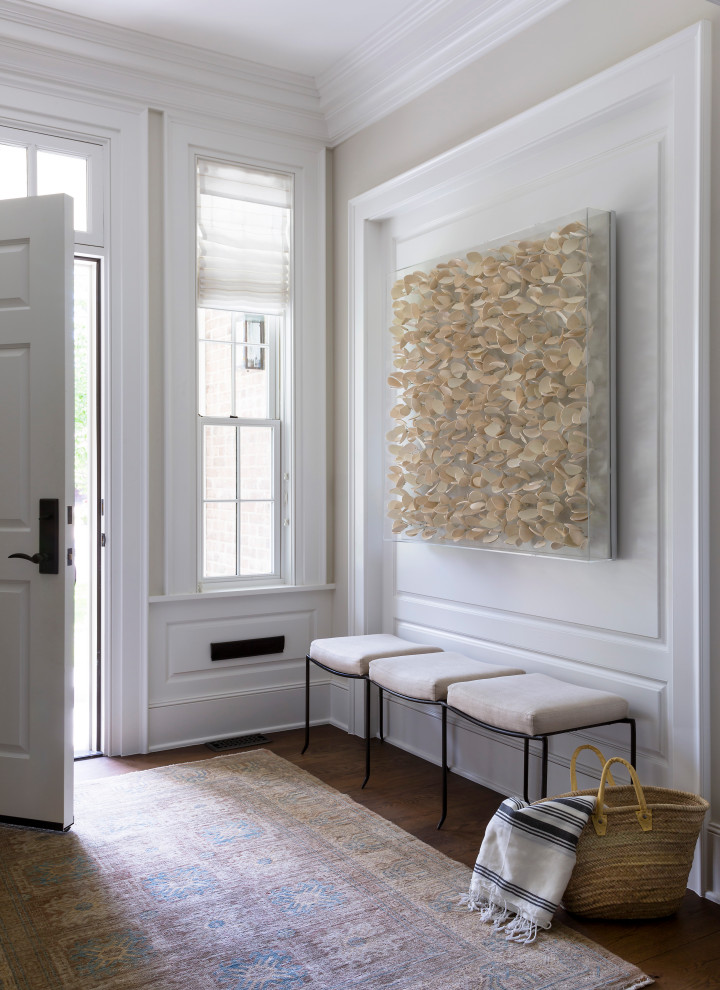 Inspiration for a transitional dark wood floor and wall paneling foyer remodel in Denver