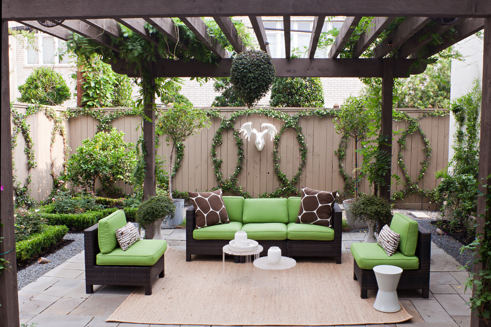 Photo of a transitional patio in Houston with a pergola.