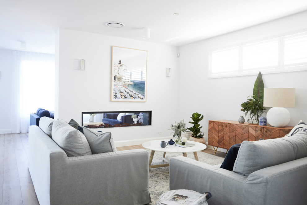 Design ideas for a beach style living room in Sydney.