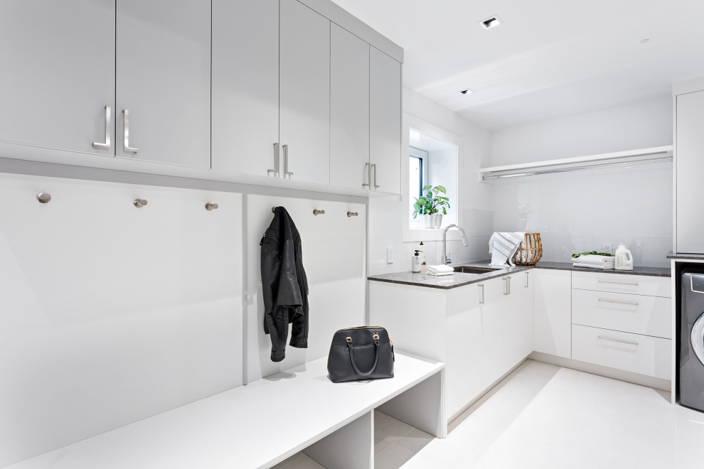 Mid-sized trendy porcelain tile and white floor mudroom photo in Vancouver with white walls