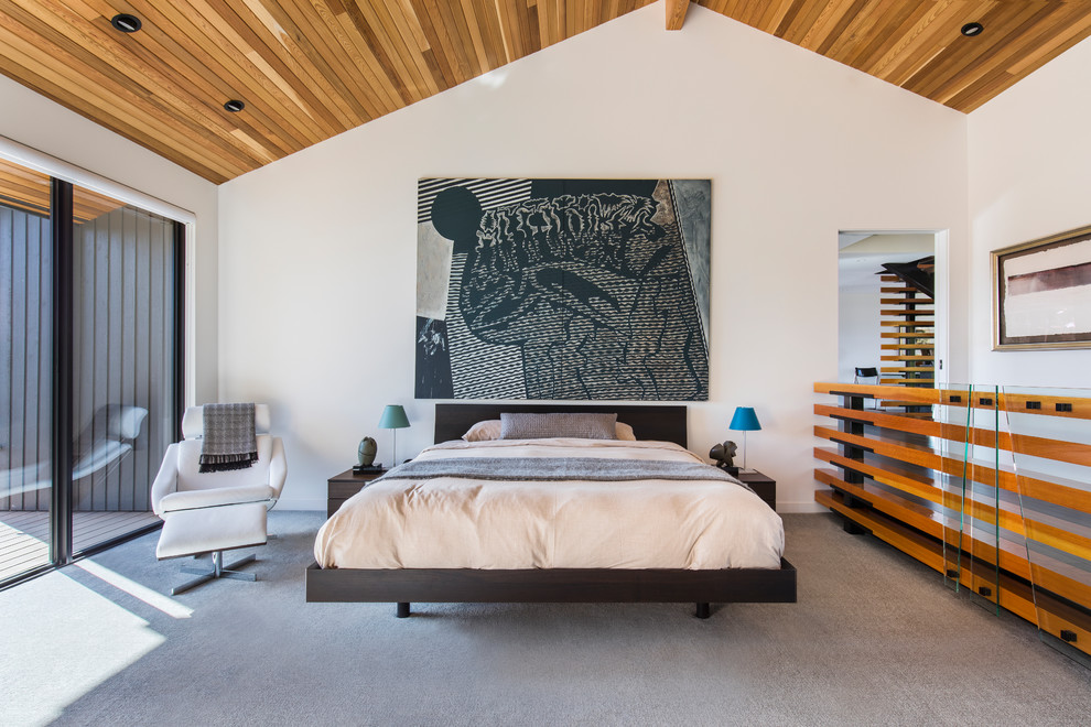 Design ideas for a large contemporary master bedroom in Portland with white walls, carpet and grey floor.