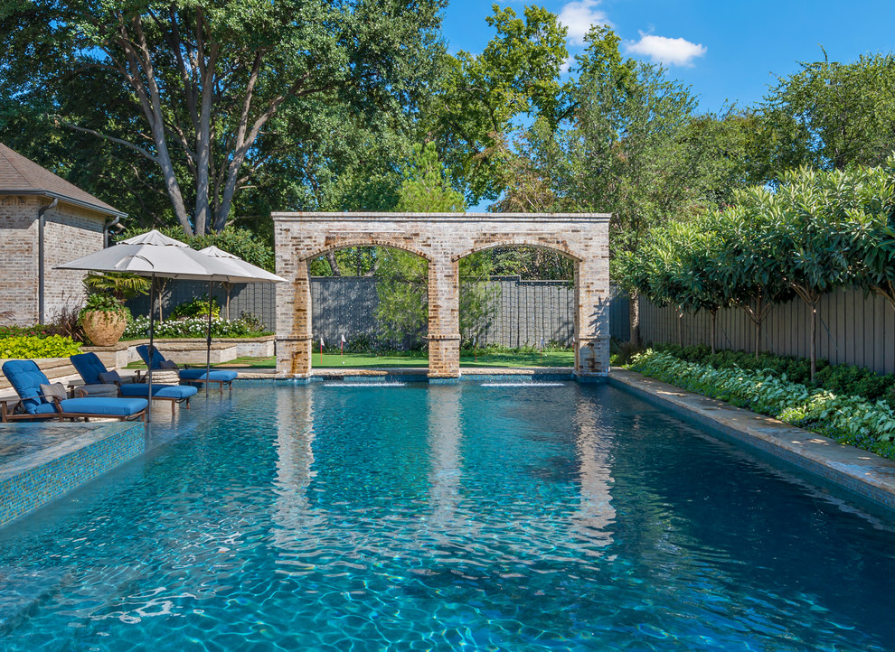 Inspiration for a traditional rectangular pool in Dallas.