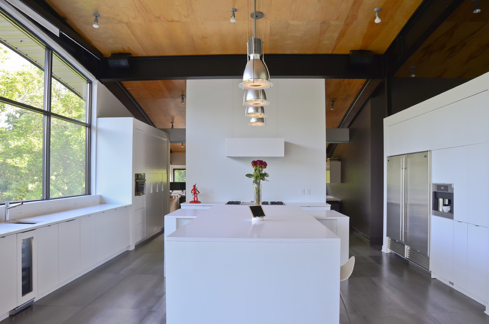 Inspiration for a large contemporary porcelain tile and gray floor eat-in kitchen remodel in Kansas City with an undermount sink, flat-panel cabinets, white cabinets, quartz countertops, stainless steel appliances and two islands