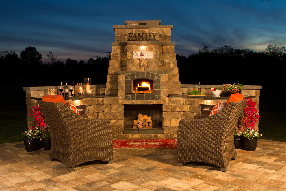 Design ideas for a small traditional backyard patio in Jacksonville with natural stone pavers, no cover and with fireplace.