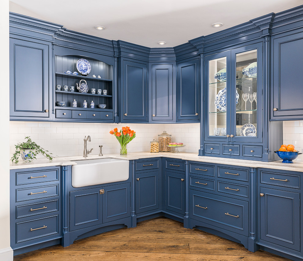 Inspiration for a small traditional l-shaped separate kitchen in New York with a farmhouse sink, beaded inset cabinets, blue cabinets, soapstone benchtops, white splashback, subway tile splashback, panelled appliances, medium hardwood floors and no island.