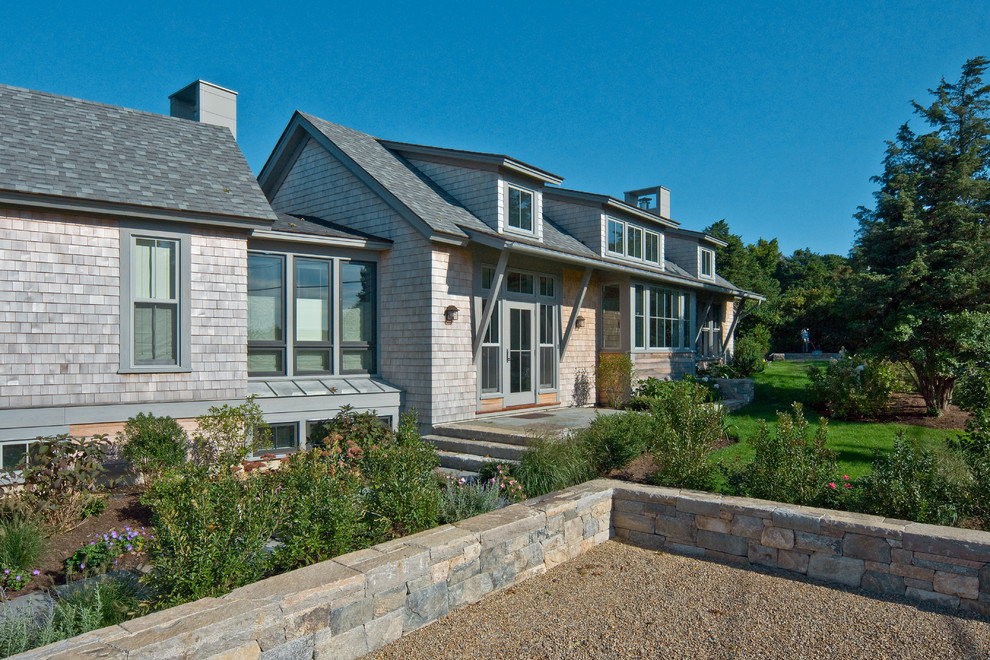 Beach style exterior in Boston with wood siding.