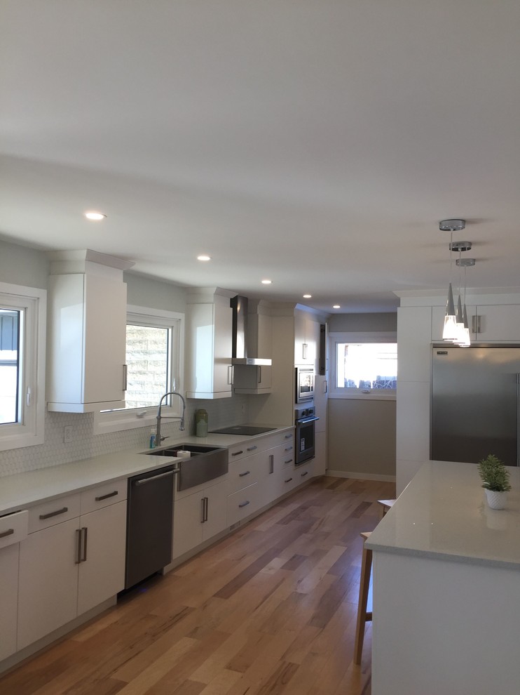 Example of a porcelain tile kitchen design with quartz countertops, ceramic backsplash and gray countertops