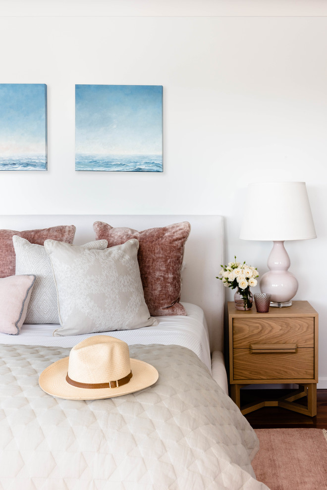 This is an example of a beach style bedroom in Brisbane.