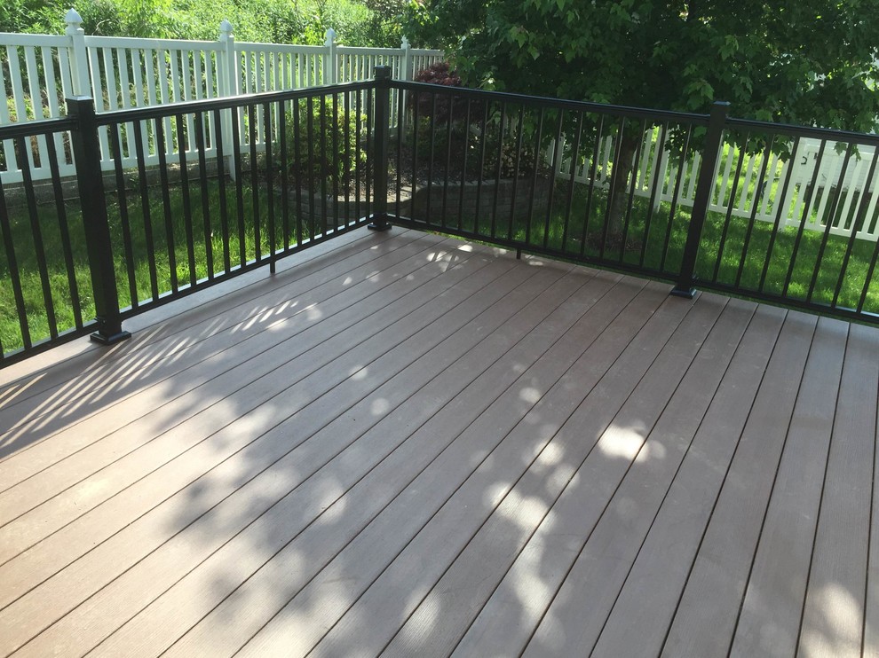 Inspiration for a small timeless backyard deck remodel with no cover