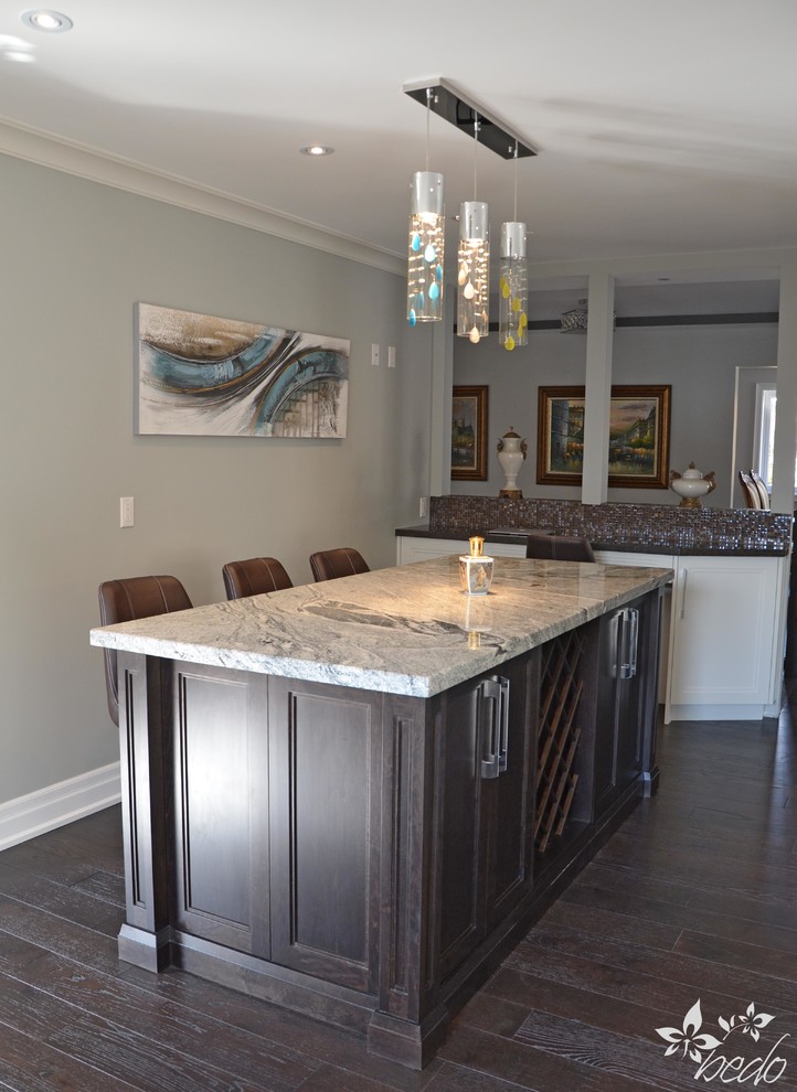 Mid-sized transitional l-shaped dark wood floor home design photo in Toronto with a double-bowl sink, shaker cabinets, white cabinets, quartz countertops, brown backsplash, mosaic tile backsplash, stainless steel appliances and an island