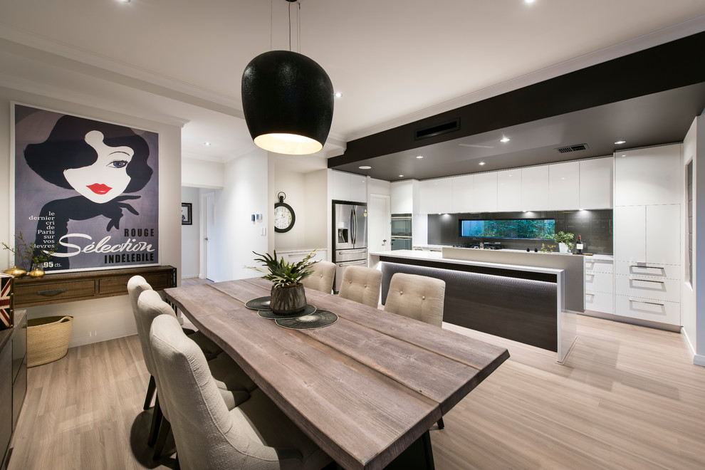 This is an example of a large contemporary open plan dining in Perth with white walls and light hardwood floors.