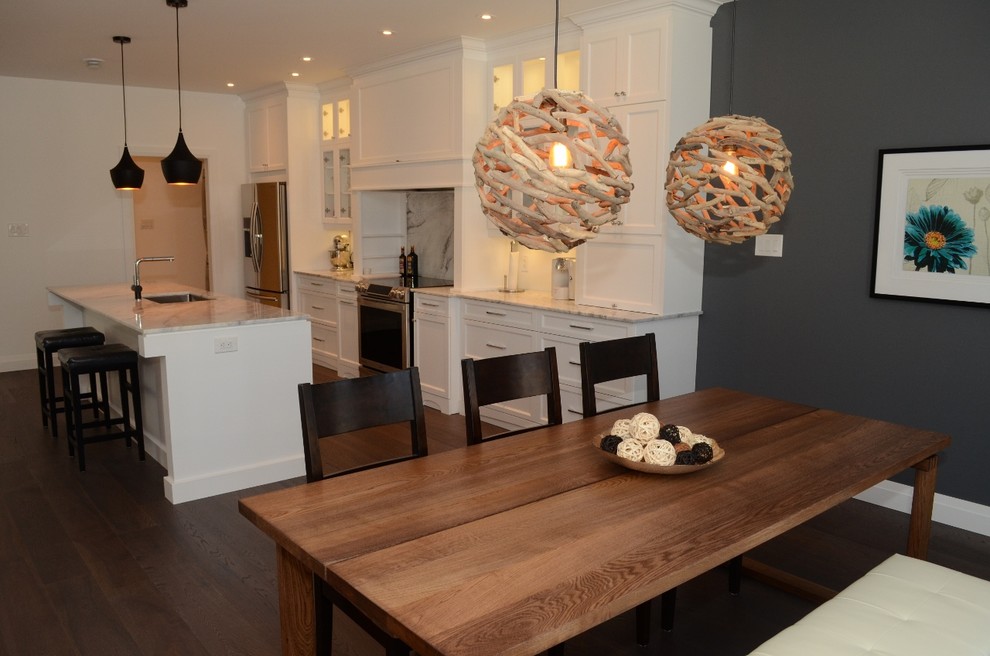 Mid-sized transitional single-wall eat-in kitchen photo in Toronto with recessed-panel cabinets, white cabinets, stainless steel appliances and an island