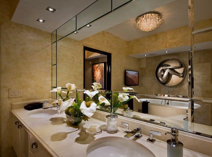 Design ideas for a mid-sized contemporary master bathroom in Miami with flat-panel cabinets, white cabinets, a freestanding tub, beige tile, stone slab, yellow walls, an undermount sink and solid surface benchtops.