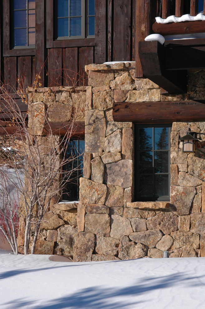 Example of a mountain style home design design in Denver