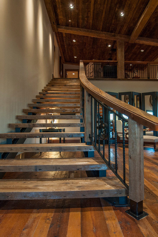 Design ideas for a mid-sized country wood straight staircase in Bridgeport with open risers.