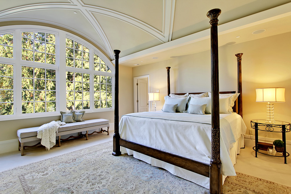 This is an example of a traditional bedroom in Seattle with beige walls.