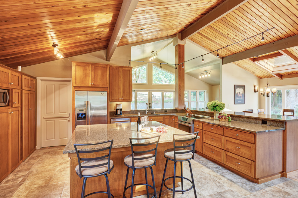 Example of a large mountain style u-shaped ceramic tile open concept kitchen design in Portland with a double-bowl sink, shaker cabinets, medium tone wood cabinets, quartz countertops, stainless steel appliances, an island and brown backsplash