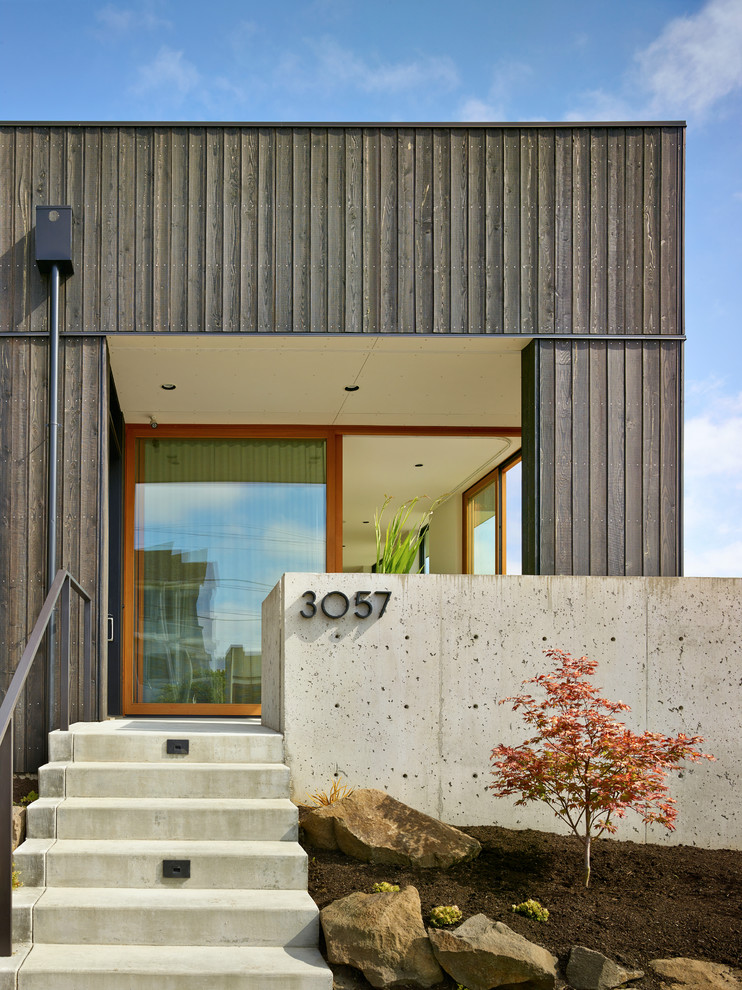 Inspiration for a contemporary front door in Seattle with a glass front door.