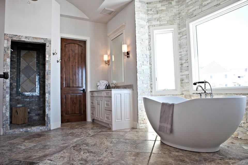 Country bathroom in Milwaukee with an open shower, gray tile and stone tile.