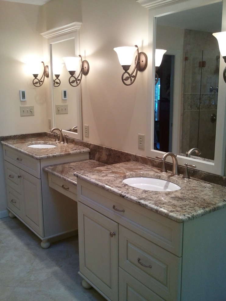 Transitional master beige tile and ceramic tile alcove shower photo with an undermount sink, raised-panel cabinets, white cabinets, granite countertops, an undermount tub and beige walls