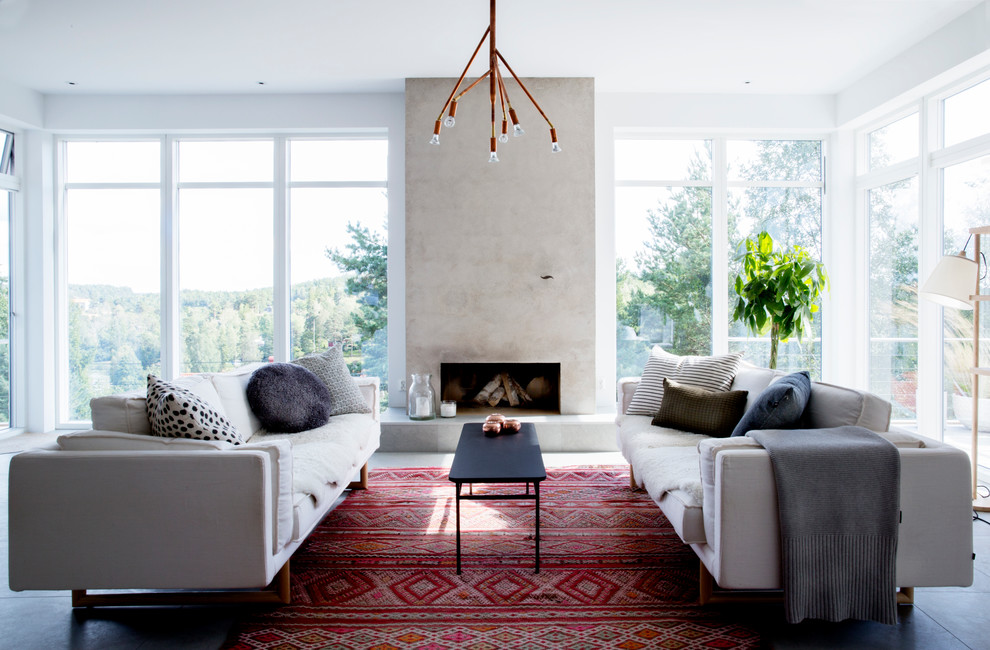 Design ideas for a mid-sized contemporary formal open concept living room in Stockholm with a ribbon fireplace, white walls, limestone floors, a concrete fireplace surround and no tv.