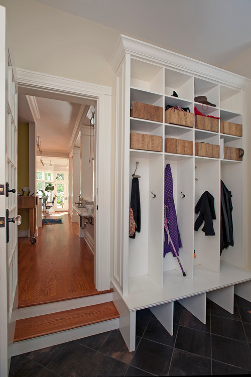 Design ideas for a mid-sized traditional mudroom in New York with beige walls, slate floors, a single front door, a white front door and black floor.